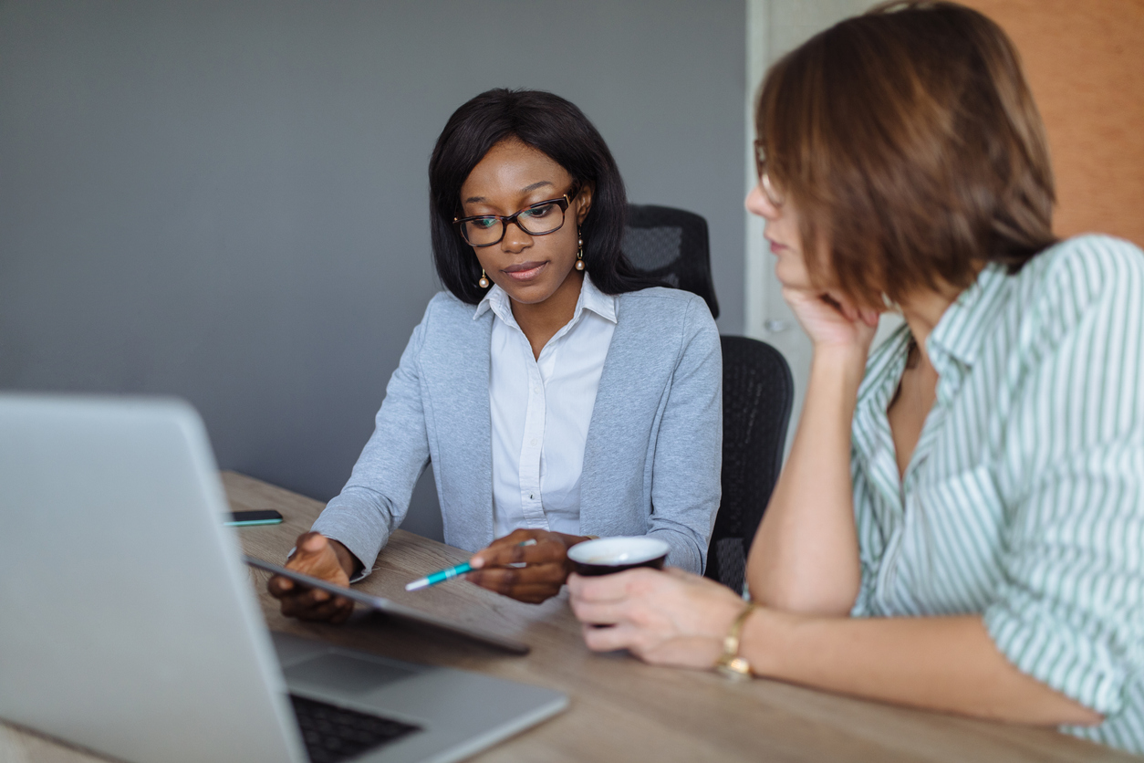 A financial advisor reviewing REITs with a client.