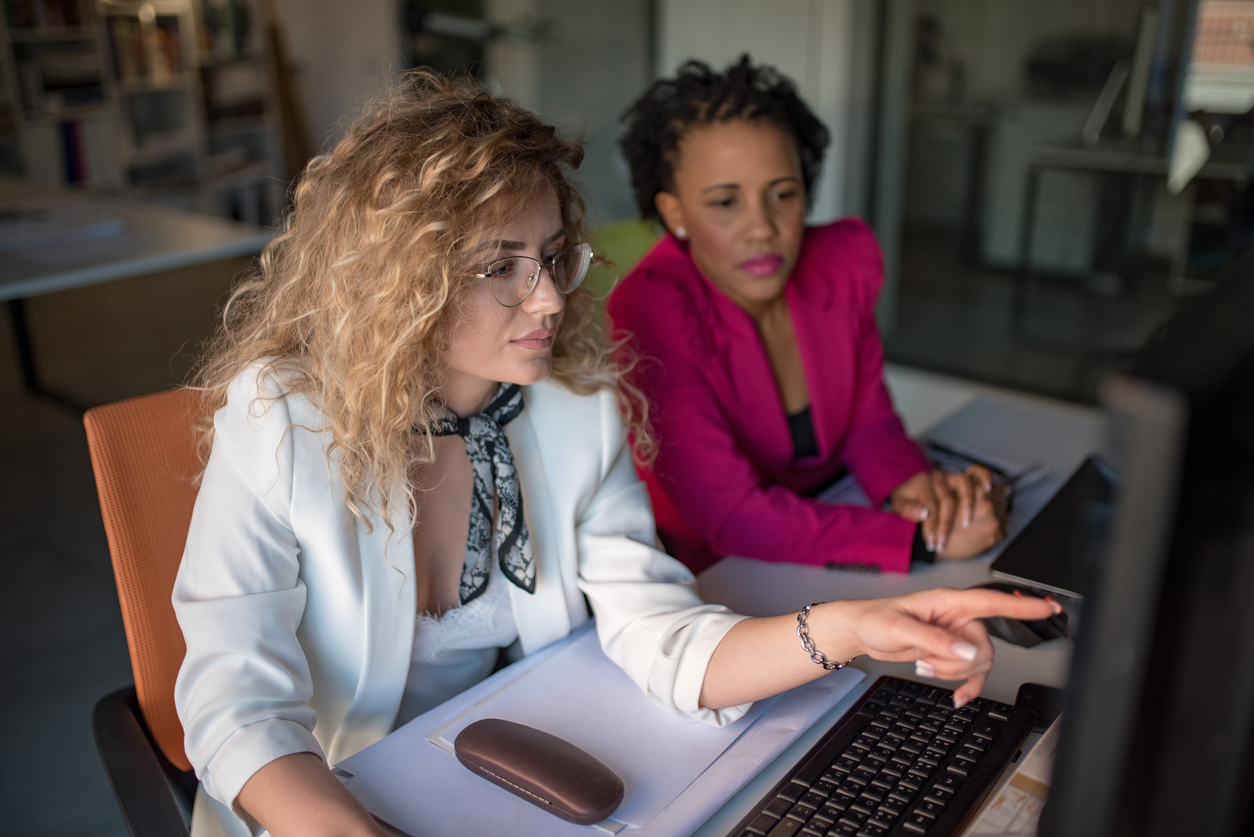 A financial advisor reviews an investment portfolio with a client.