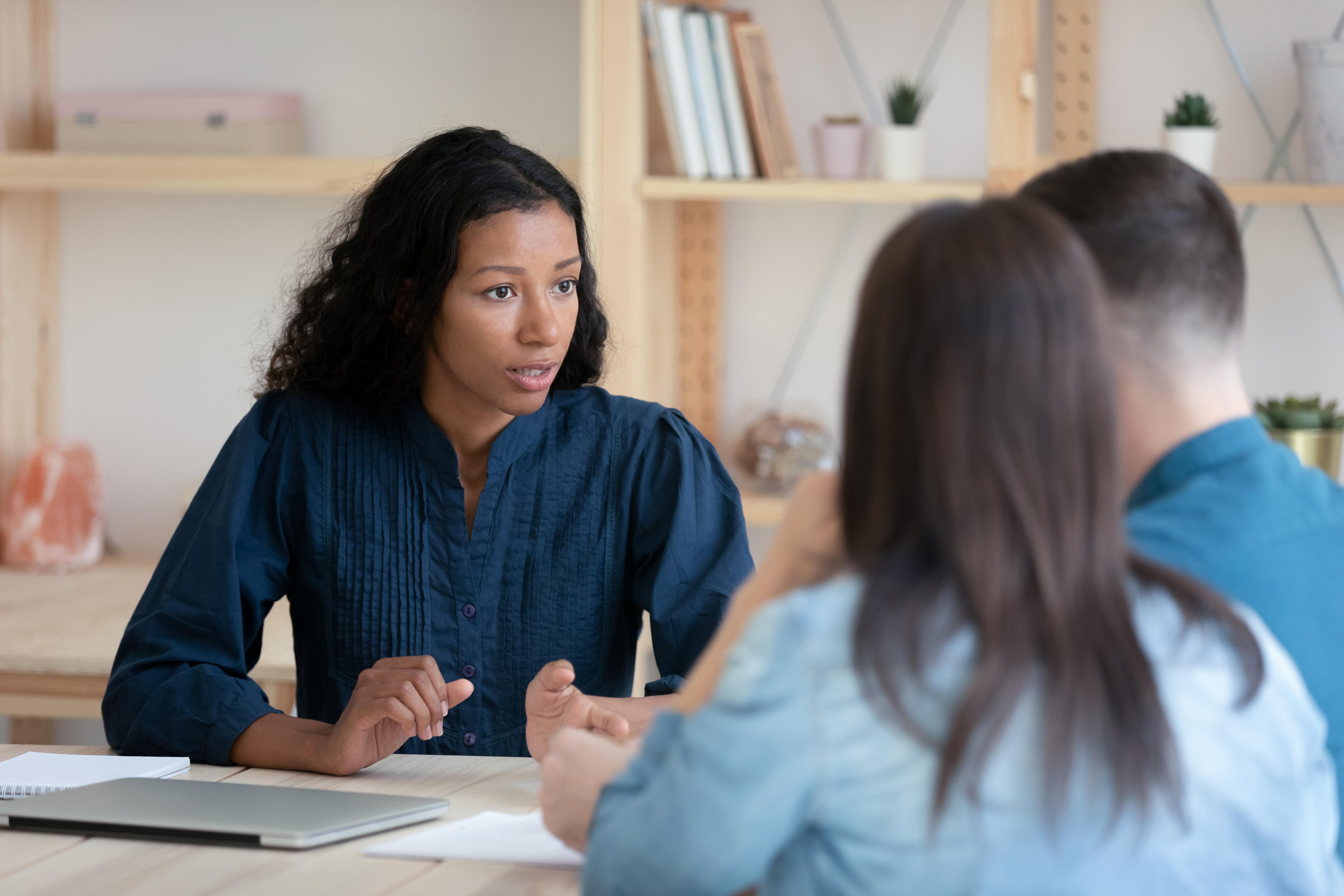 A couple working with a financial therapist.