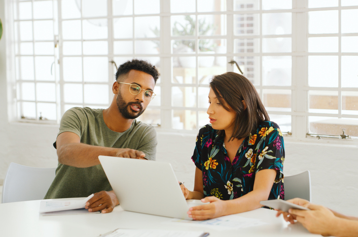 Investors reviewing an investment plan for their portfolio.