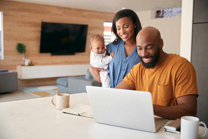 Parents creating a savings plan for their child.