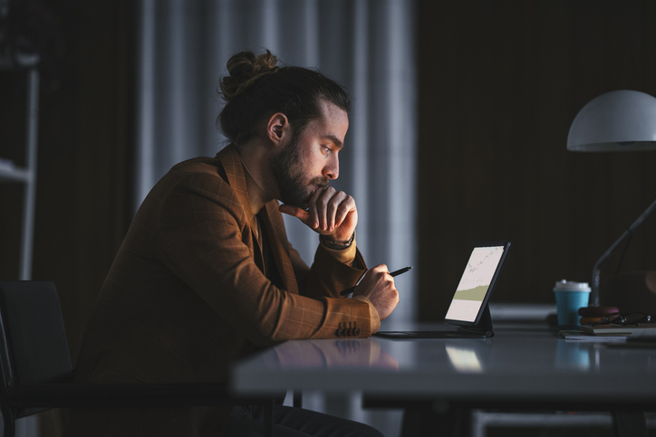 A man researching easy ways to make investments.