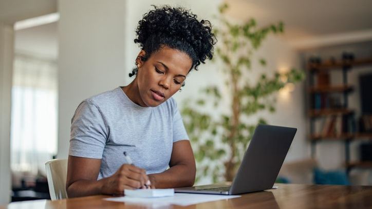 A woman creates a will using an online service. 