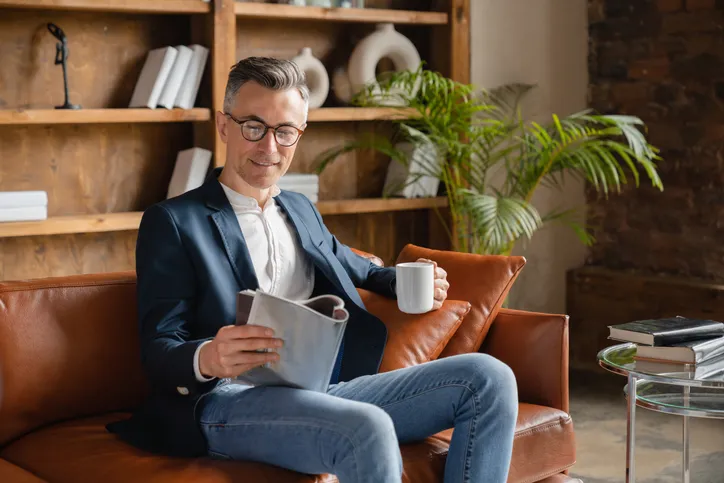 A man flips through a sales book for financial advisors.