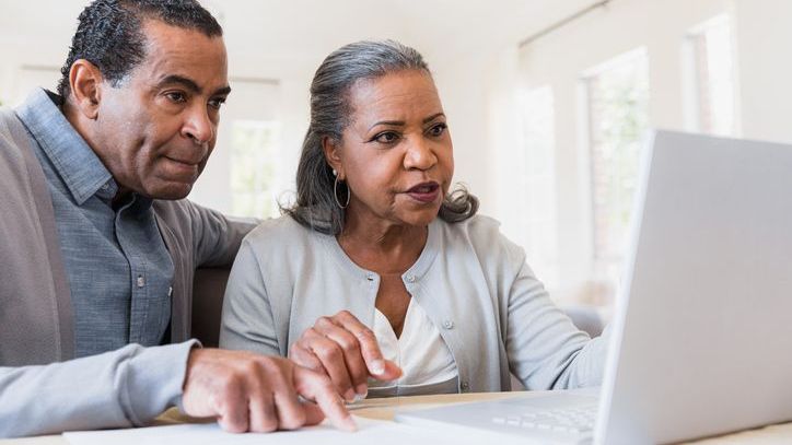 A woman and her husband look over their 401(k) account balances and contemplate a series of Roth conversions.