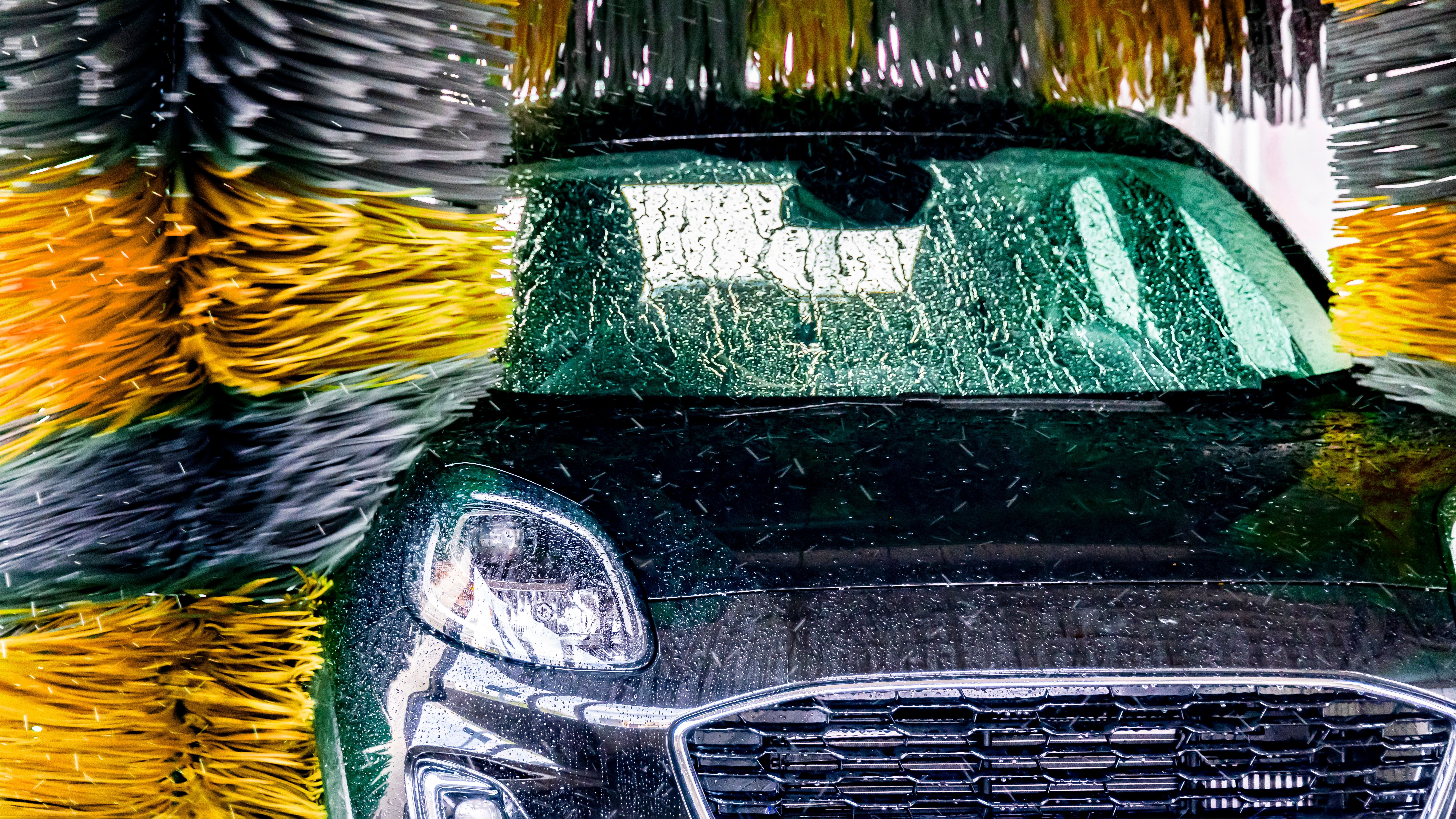 A car goes through an automatic car wash.