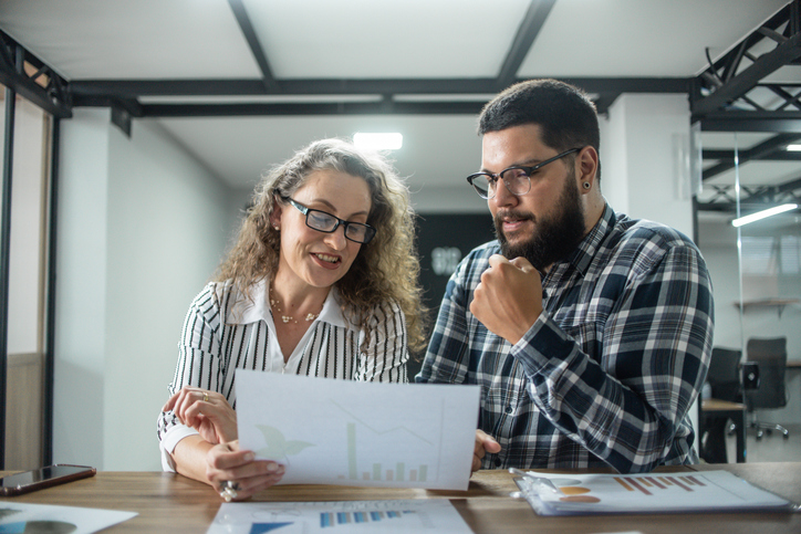 A couple reviews their real estate portfolio.