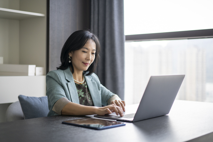 A woman looking up the requirements for real estate professional tax status.