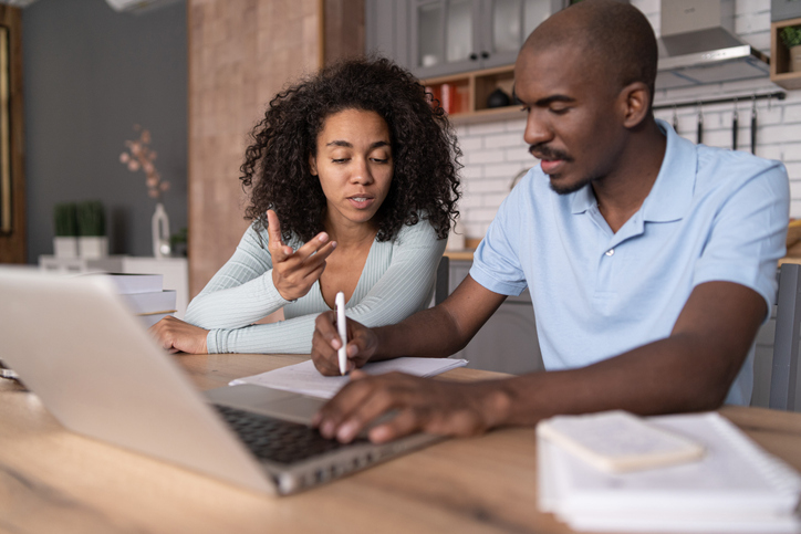 A couple researching how to start a rental property business.