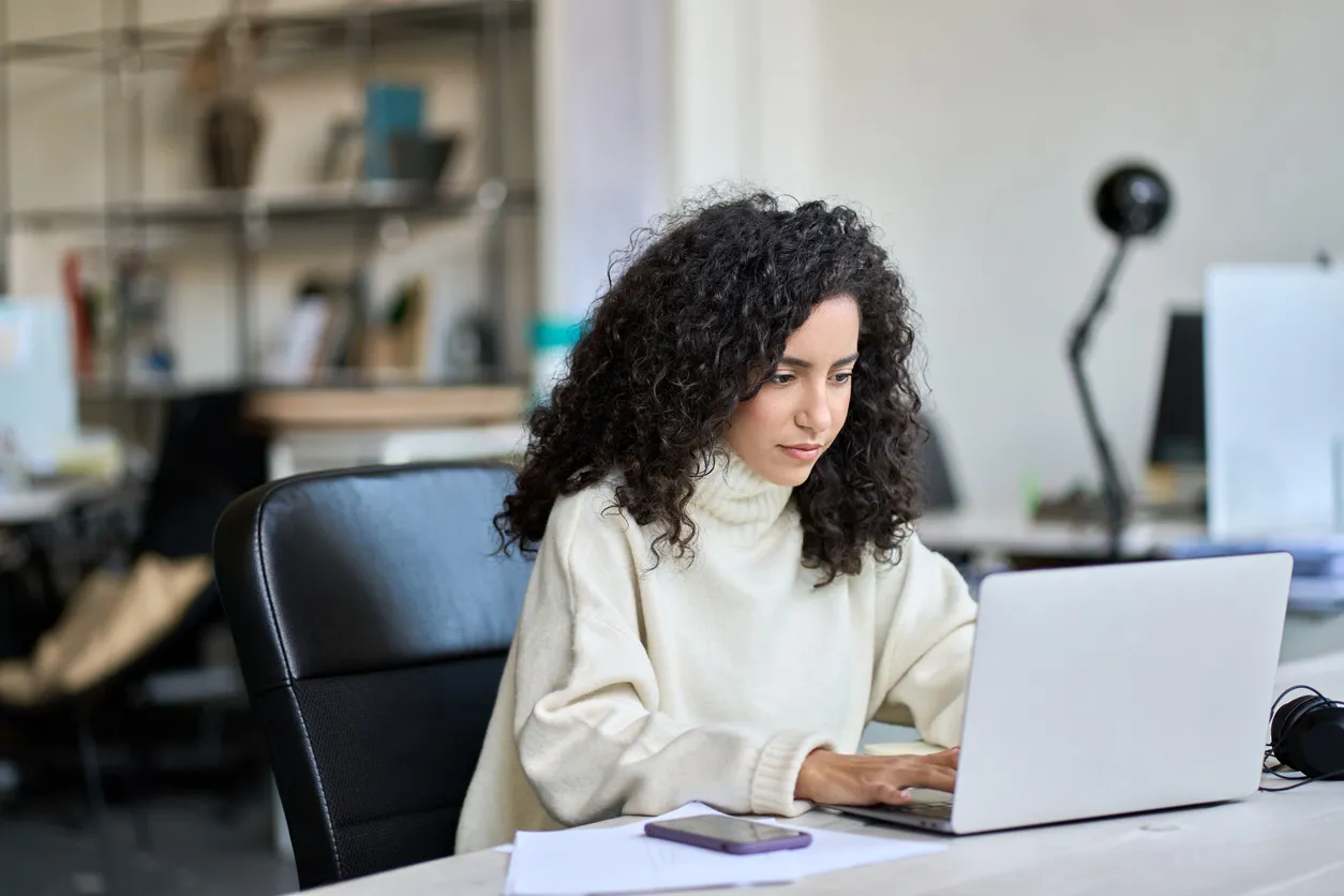 A woman looking up the maximum DTI for a mortgage.