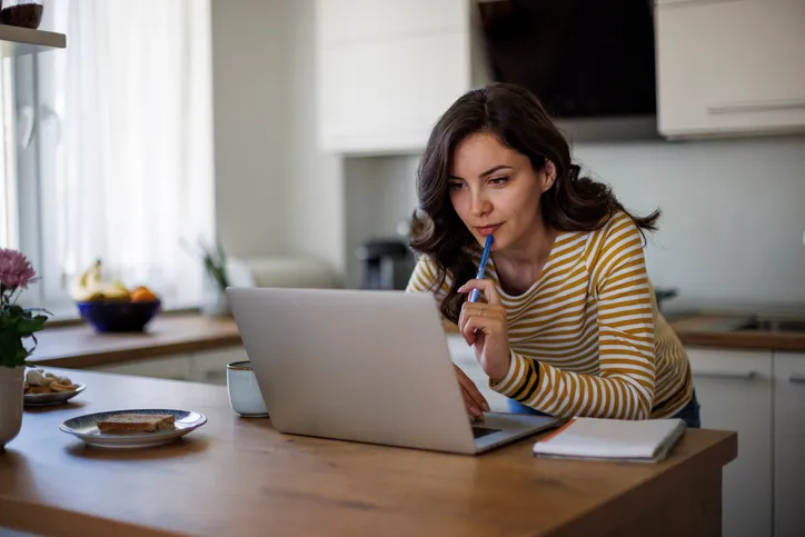 A woman researching the requirements to take out a second mortgage on a home.