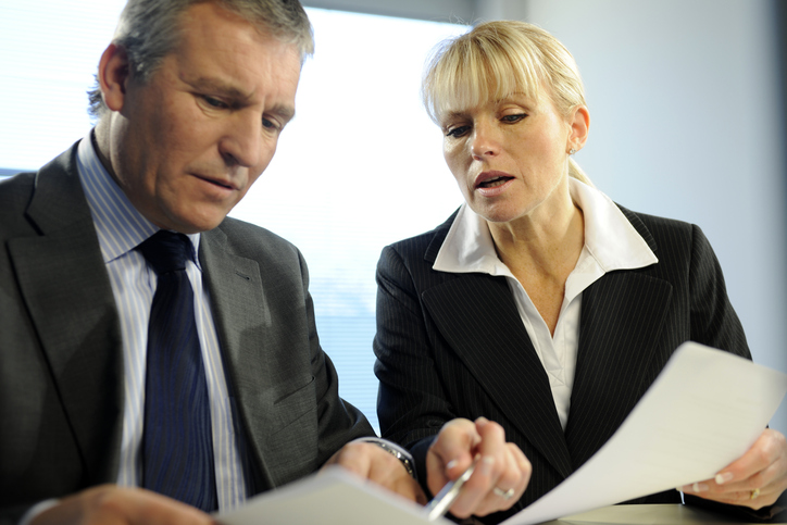 A financial advisor reviewing tax-exempt mutual funds with a client.