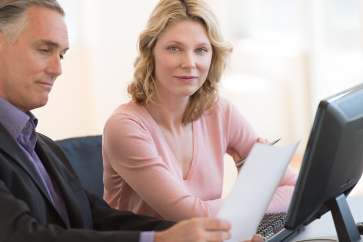 A couple reviewing examples of tax-managed mutual funds.