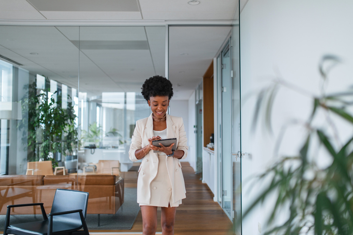 A woman researching how often an employer can contribute to an HSA.