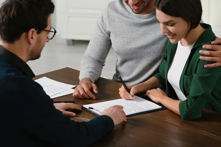 A couple creating a tax-efficient financial plan with an advisor.