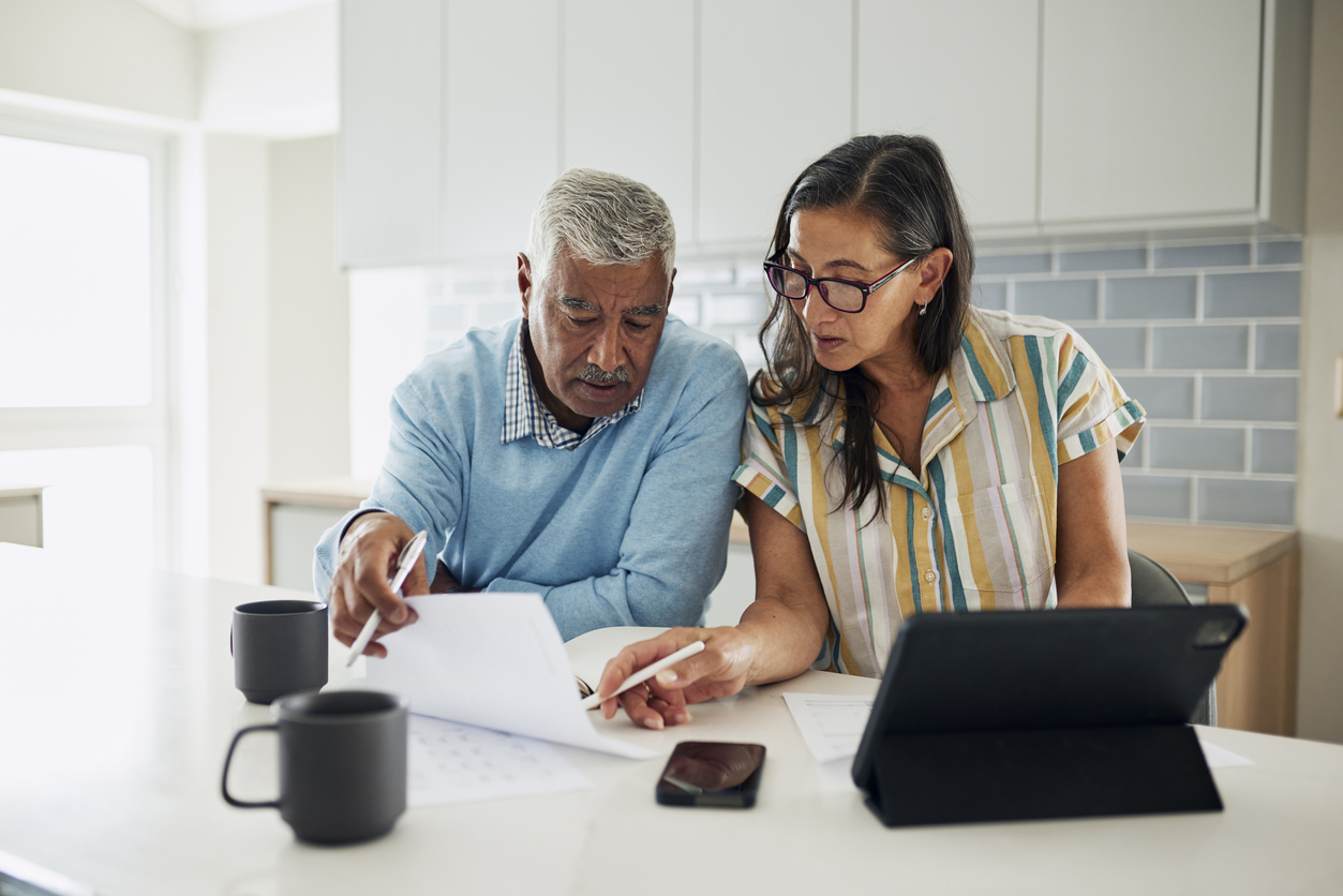 A couple creating a budget to increase their investments.