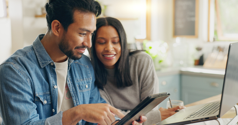 A couple reviewing options for short-term rental insurance.