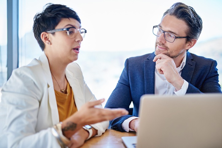 A financial advisor meeting with a client to review her portfolio.