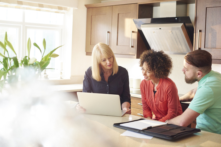 A financial advisor explaining different types of real estate investments.