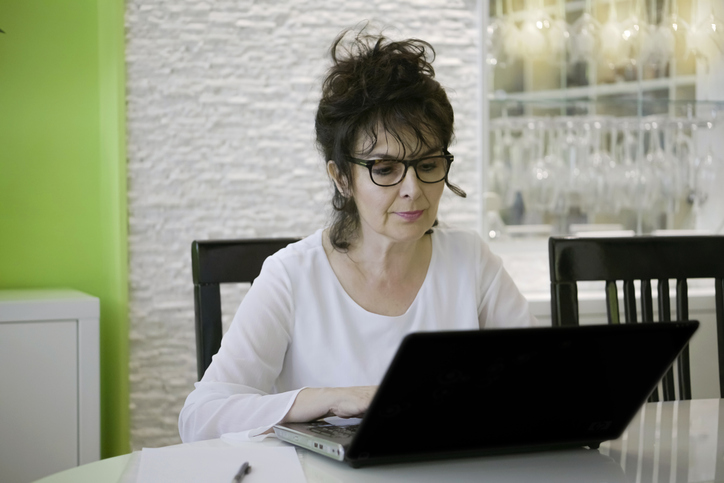 A woman researching investment opportunities with life insurance.