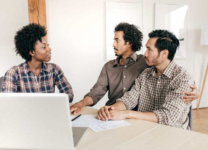 A couple discussing a financial plan with an advisor.