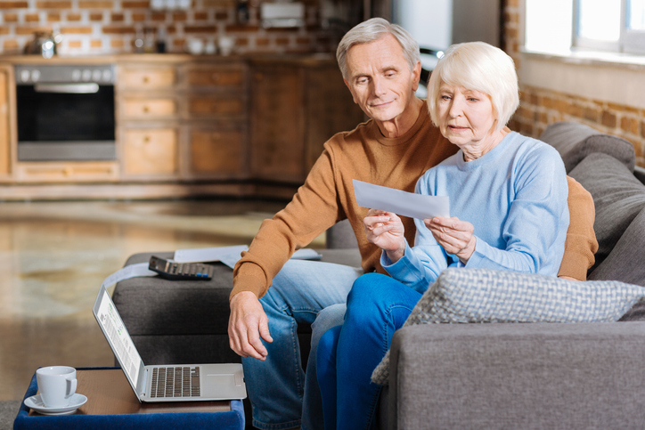 A senior couple reviewing their Social Security benefits.