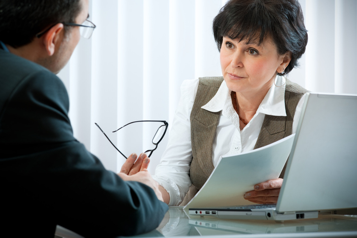 A financial advisor working with a client to rebalance their investment portfolio.