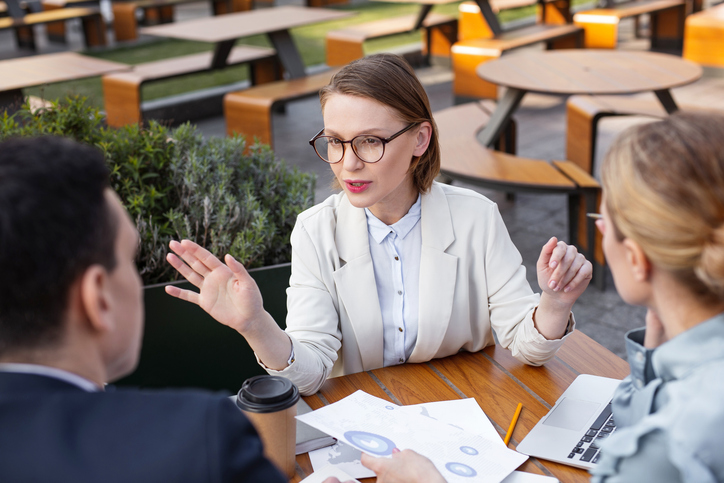 A couple meeting with an advisor to review their investment portfolio.