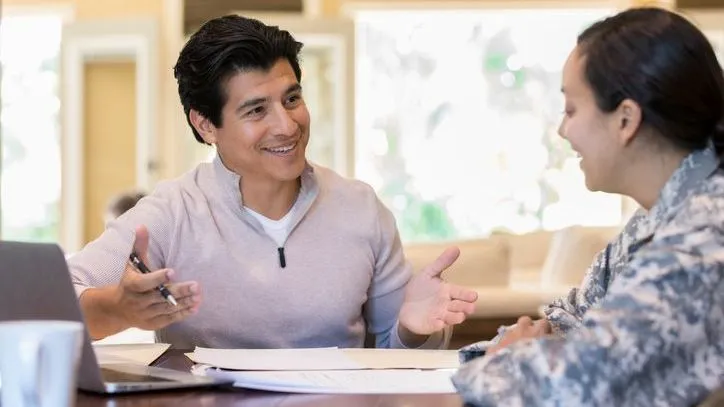 A financial advisor meets with an active duty member of the military. 