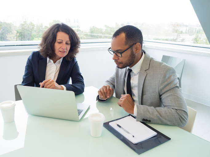 An advisor reviewing an investment portfolio with a client.