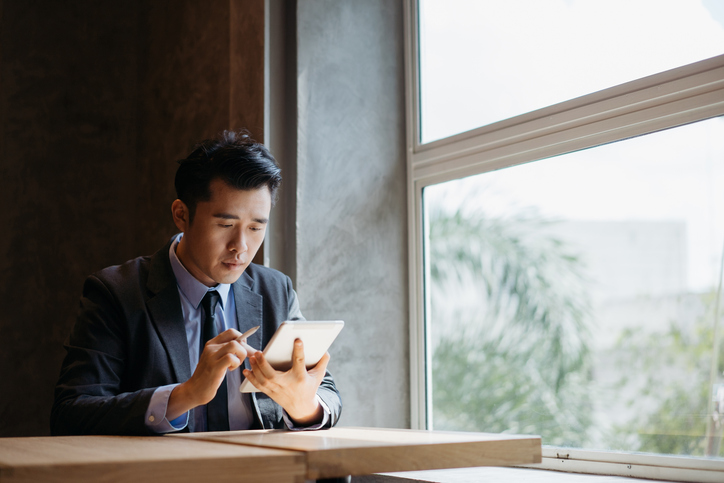 A real estate investor researching different types of REITs.