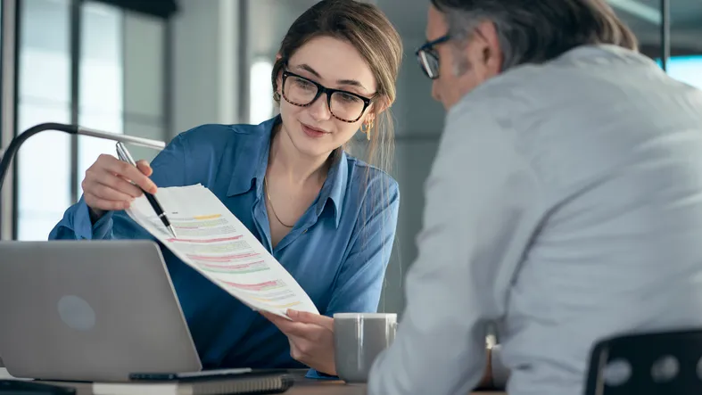 A financial advisor reviewing estate plan documents with a client.