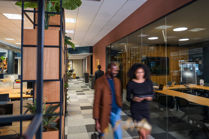 Investors touring the office of a startup.