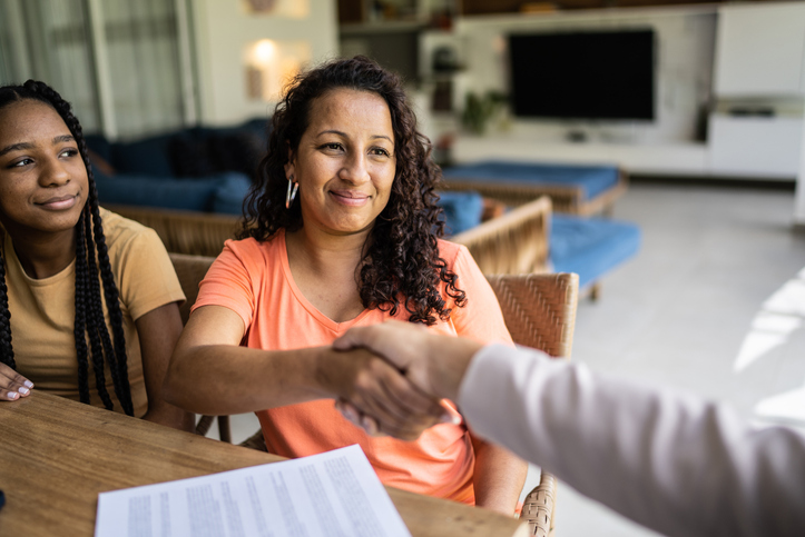 A financial advisor meeting with clients to discuss differences between marital and family trusts.