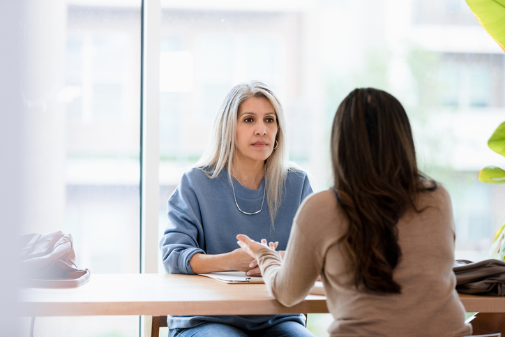 An investor working with a financial advisor to add bonds to her portfolio.