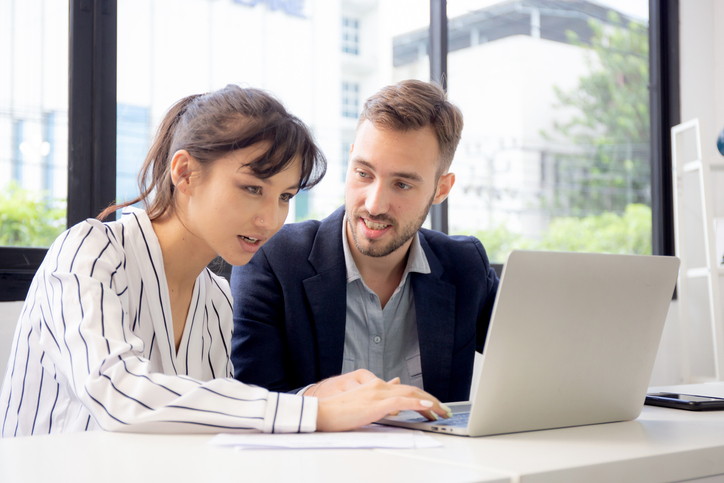 A couple researching the benefits of opening an indexed universal life (IUL) insurance account for their retirement.