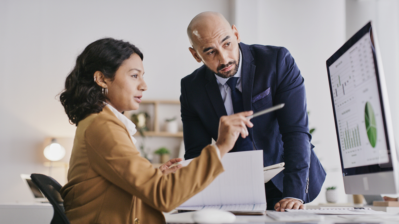 Two investors reviewing their portfolio.