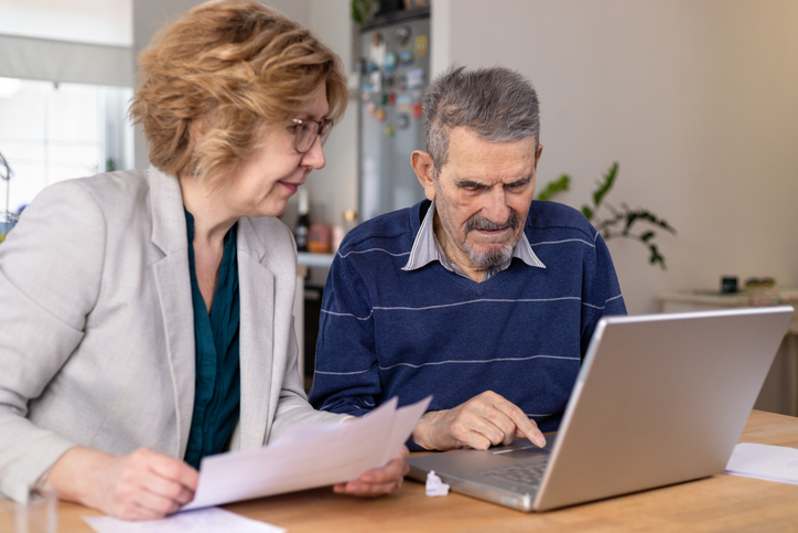 A senior couple reviewing an estate plan.