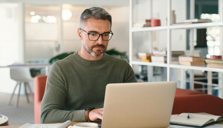 A man setting goals for his financial plan.