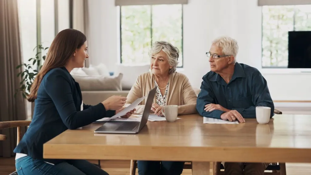 A couple meets with their financial advisor to discuss their estate planning asset checklist.