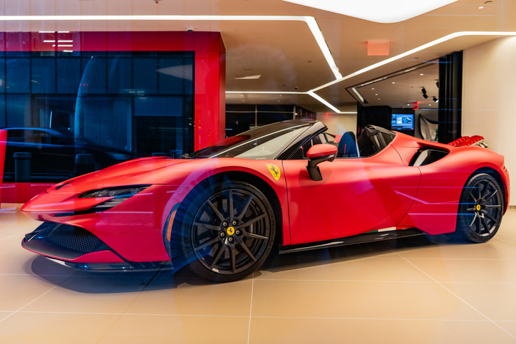 A Ferrari SF90 Stradale supercar sports car in showroom.