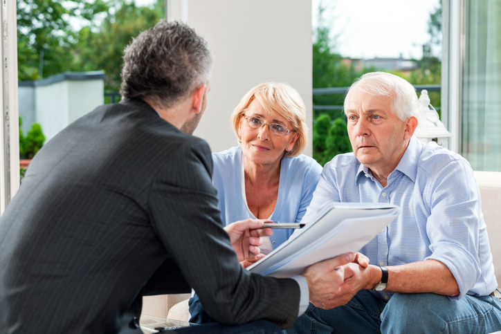 A senior couple meeting with a financial advisor to get advice about probate.