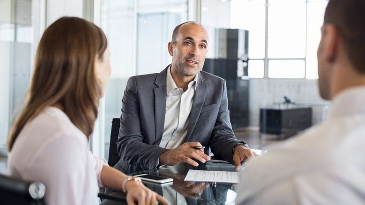 A financial advisor meets with colleagues to discuss how to how to build a referral network.