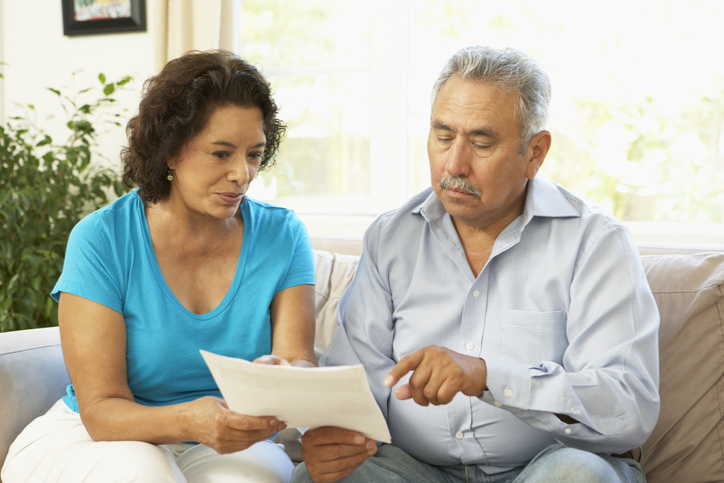 A senior couple determining how to rebalance their portfolio.