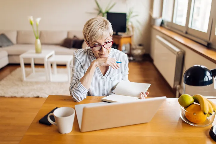 A borrower reviewing her loan payments.