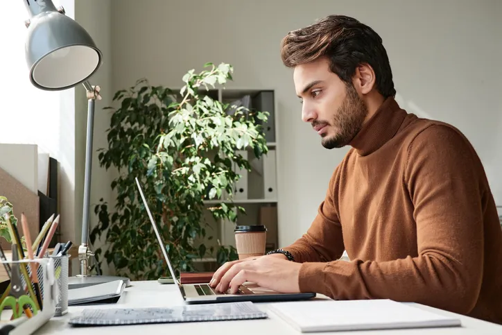 A man reviewing his financial plan, which includes an emergency fund.