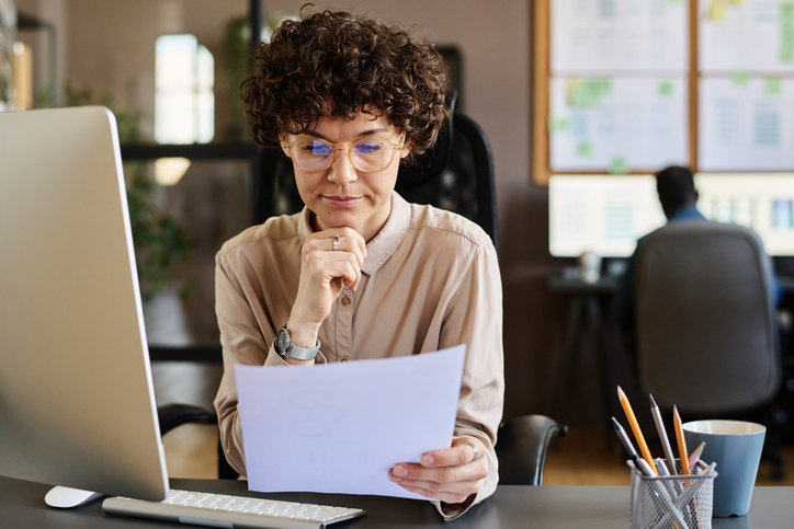 An investor reviewing documents for her portfolio.