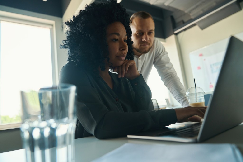 Real estate investors reviewing a portfolio.