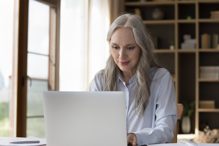 A woman comparing the pros and cons of Liquid CDs.