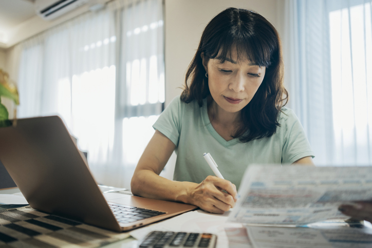 A woman preparing her taxes.